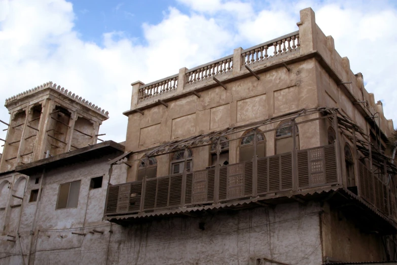 a picture of a building that has some wooden balconyes