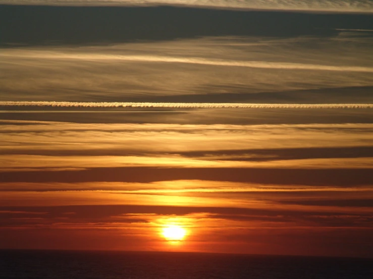 some planes flying and the sun is setting