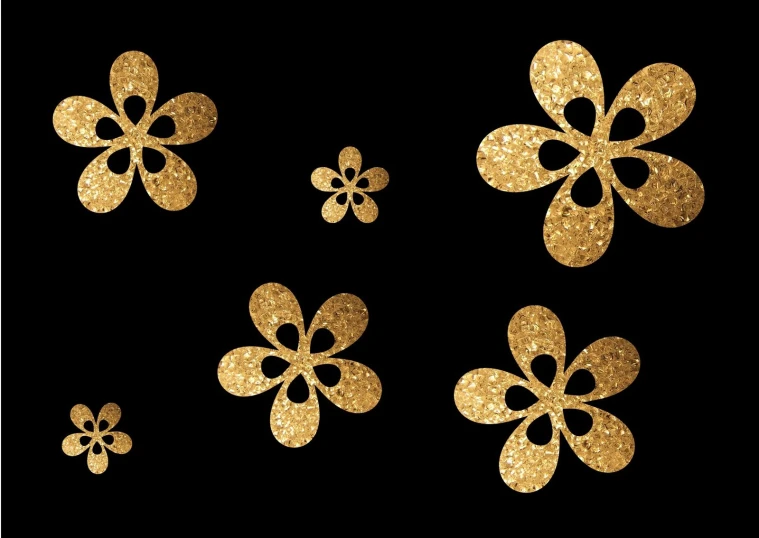 gold paper flowers on a black background