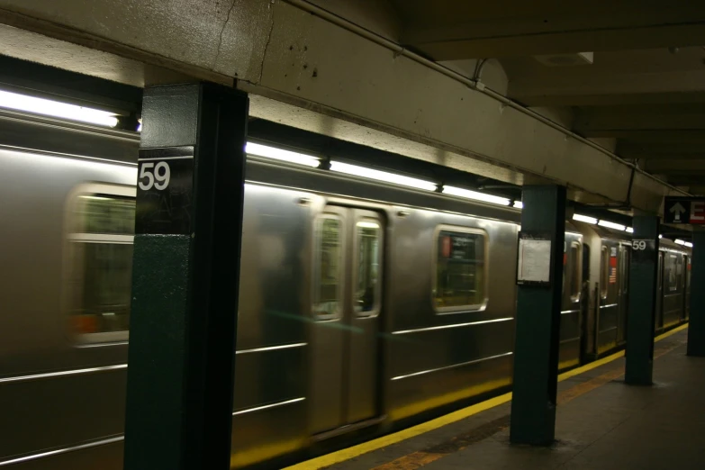 a subway train with its doors open next to a platform