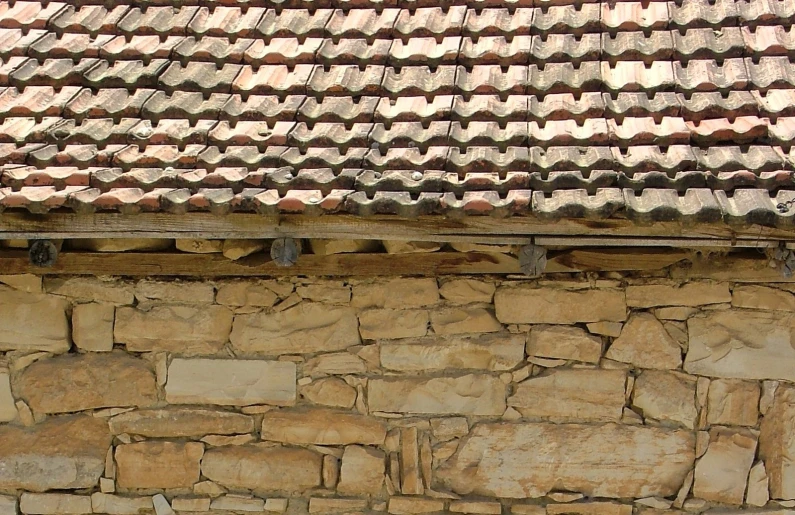 this picture is of a wall with stone bricks