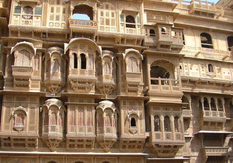 a large building with balconying on top and other ornate architectural details