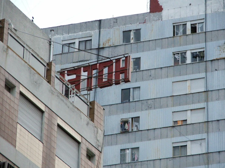 a red sign on the side of a building