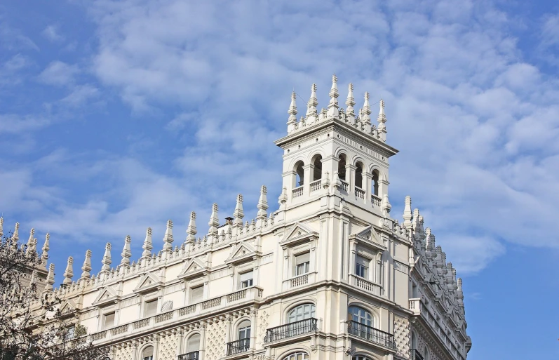 a tall clock tower on top of a white building