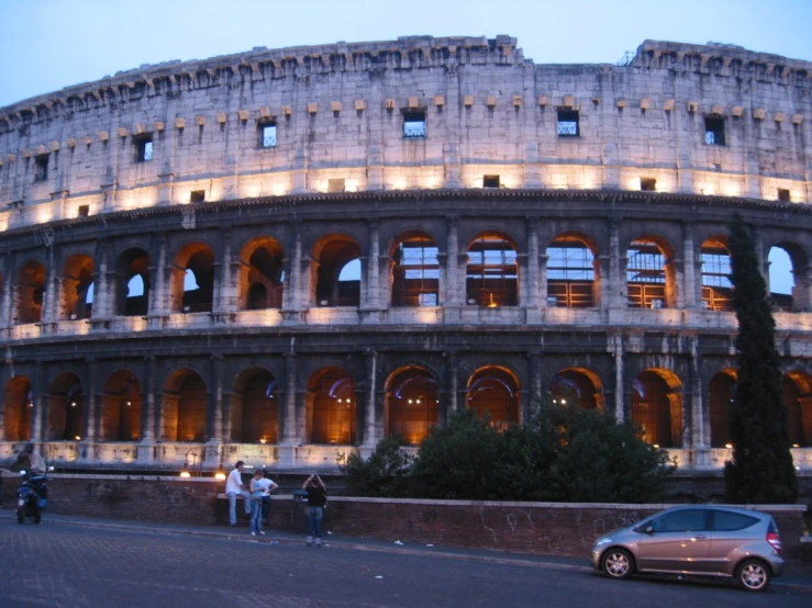 two cars parked in front of the famous building