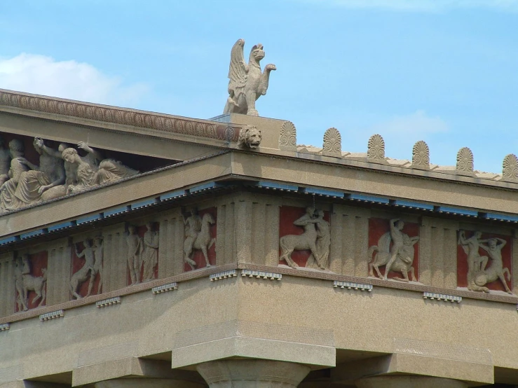 a building with designs and statues on it