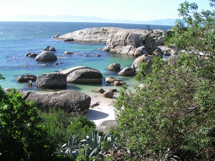 water sitting between two large rocks that look like they are on the shore