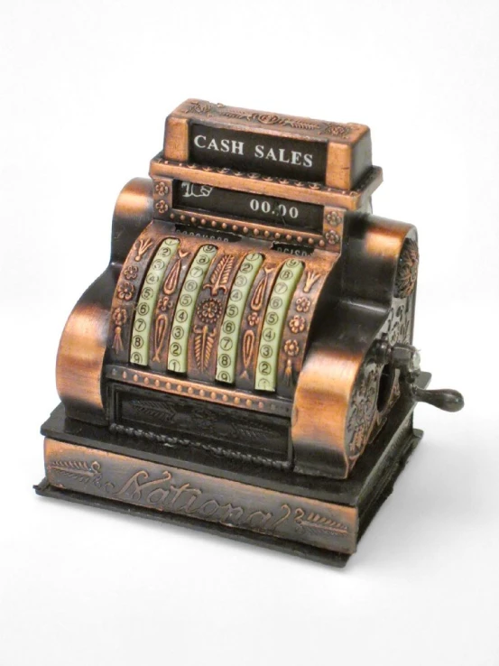 a metal spinning cash register sitting on a white background