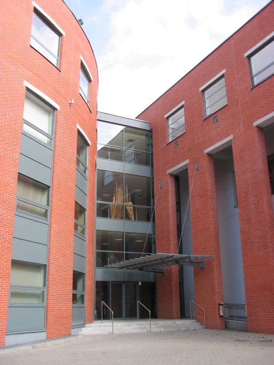 an entry to an apartment building with steps