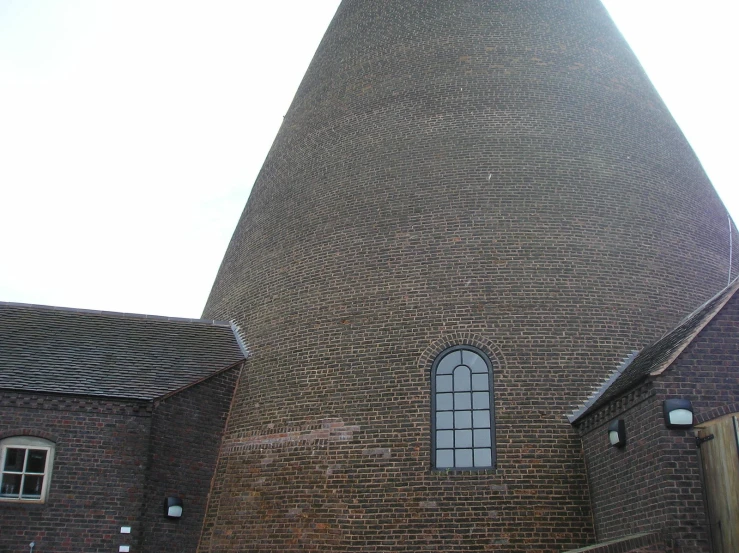 a large brick building with a very tall clock tower