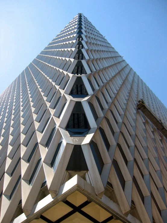 the triangular building has many windows on each side