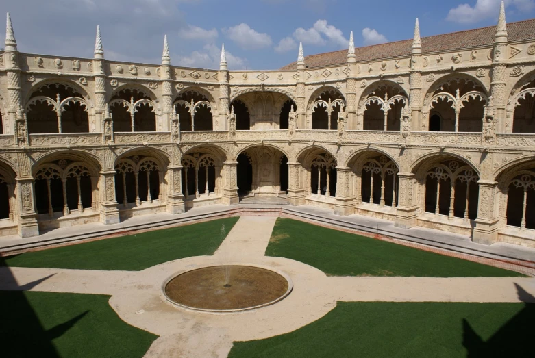 there are large courtyards with some green lawn