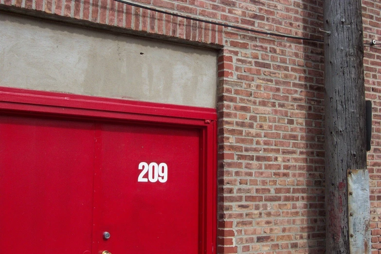 a fire hydrant is next to an old brick building