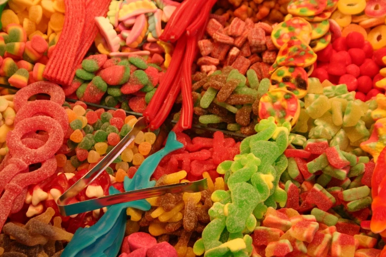 a pile of lots of various candies in a bowl