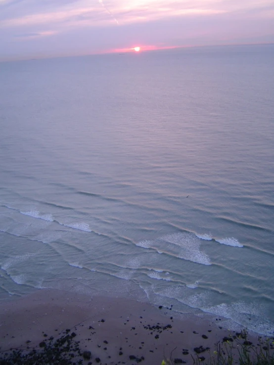 a beach next to a small body of water