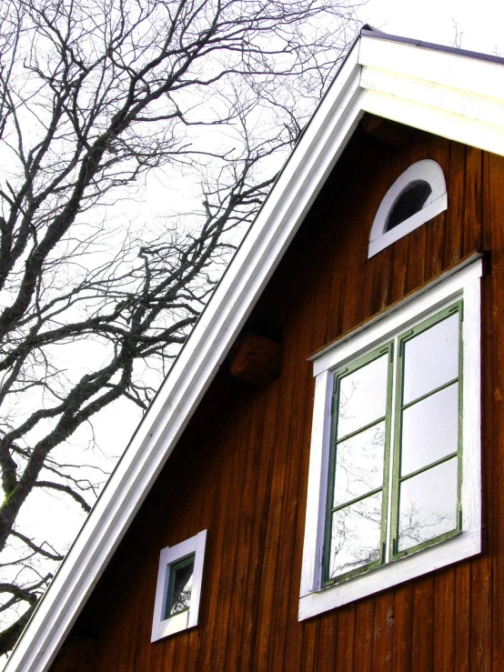 a window of a wooden house in winter