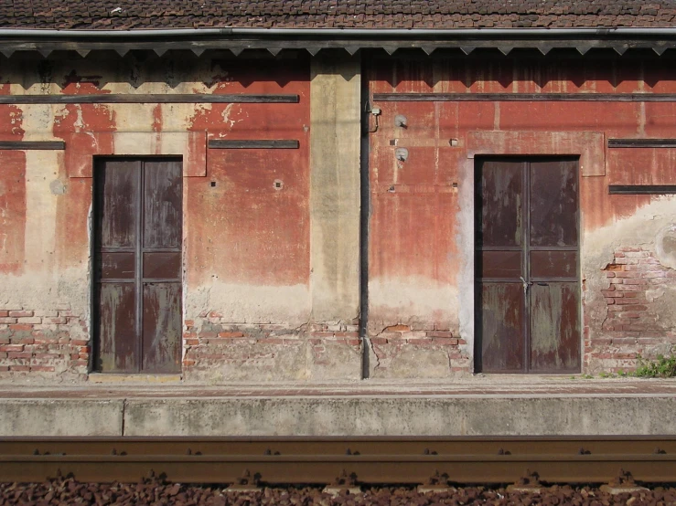 some windows a train tracks and a building