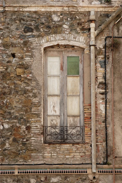 a window sitting next to a brick building