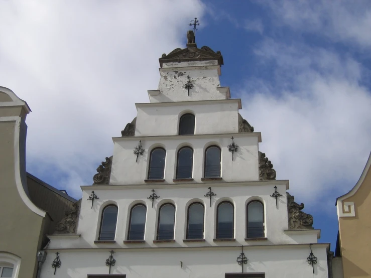 a clock tower above a building with three stories