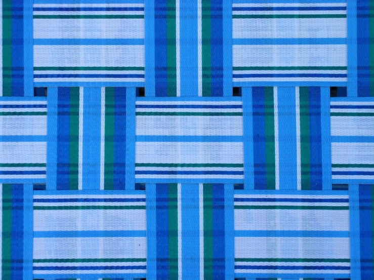 a colorful quilt with lines and a black on