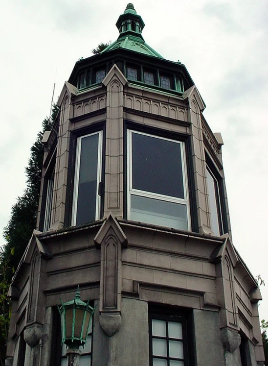 a building with a steeple and three windows