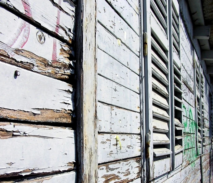 the window in the old building has graffiti