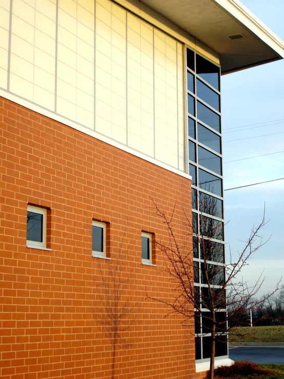 red brick building with windows on a sunny day