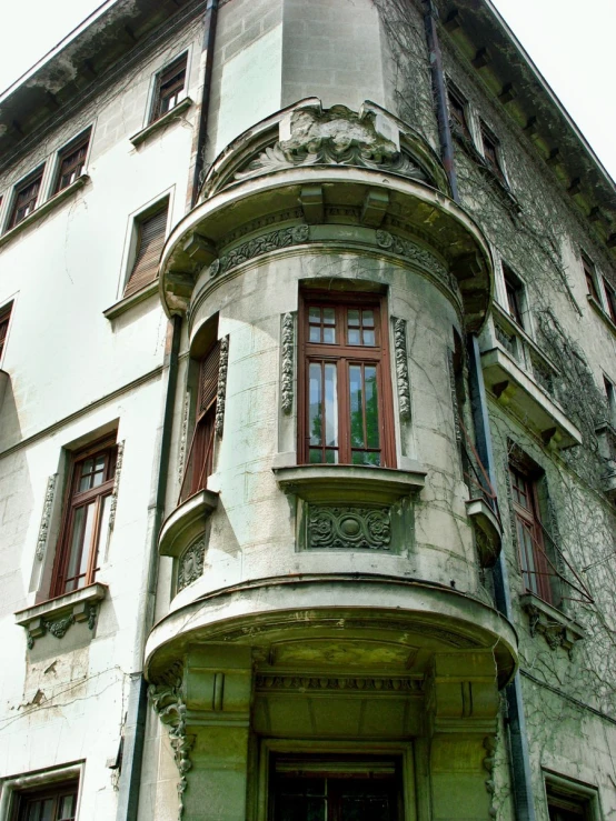 an old house with red and green shutters