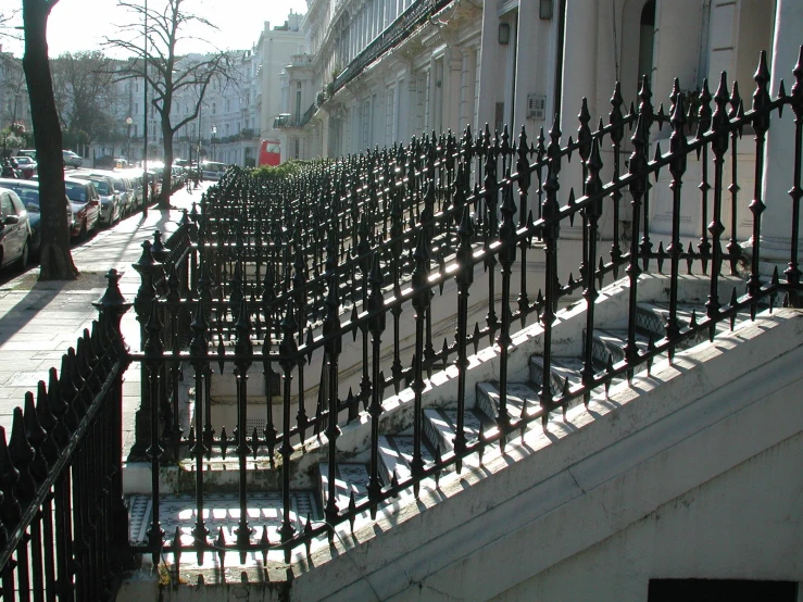 there are many buildings in the city with iron fences