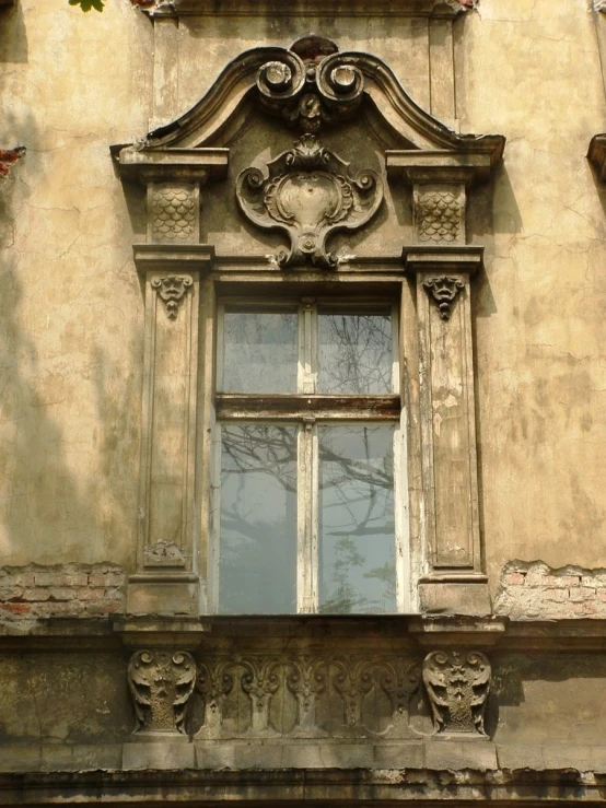 the windows of an old building with ornamental decorations
