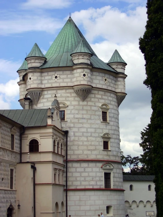 an old building with two towers on top