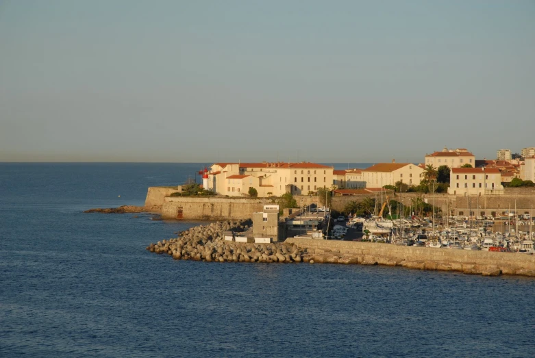 a harbor with boats docked on the side of it