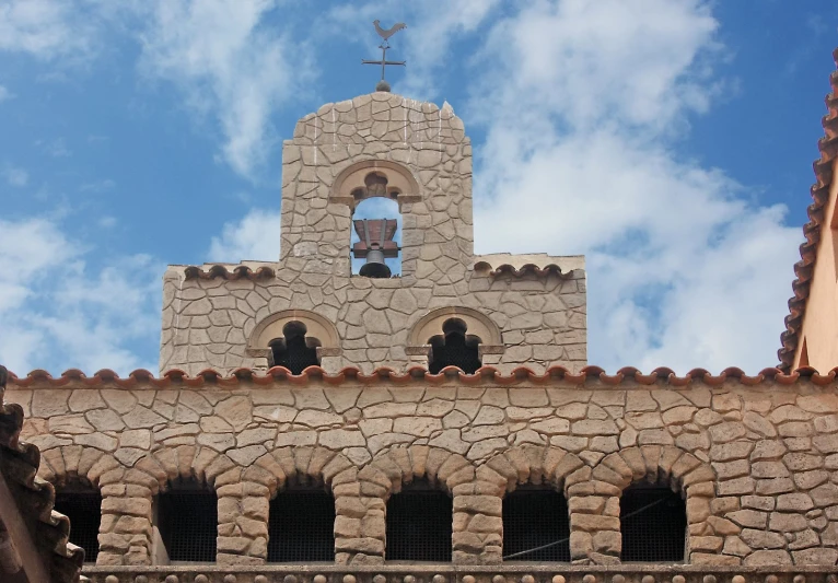 a church tower with a church bell on top