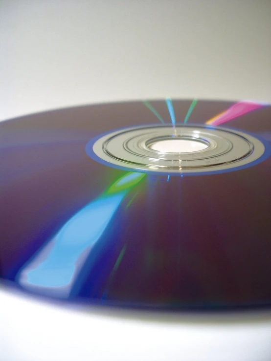 a close up of a cd disc on a table