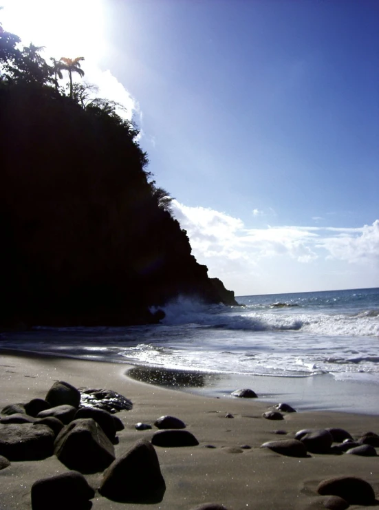 waves lapping into the shore as the sun begins to rise