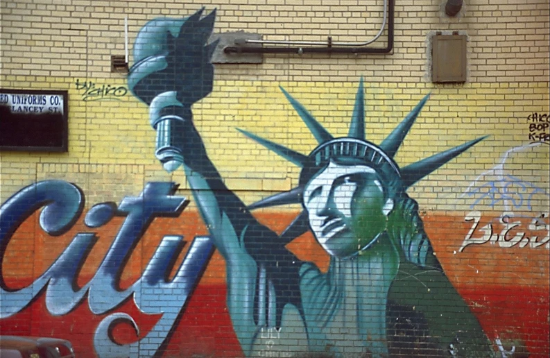 graffiti depicting the statue of liberty on a brick wall