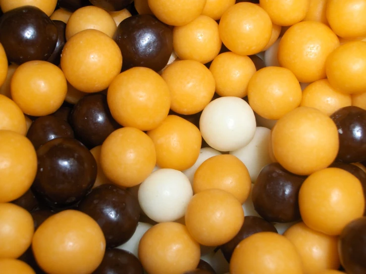 the candy balls are all different sizes and colors