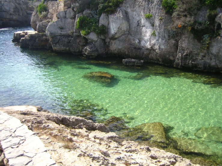 water in the stream next to large rocks