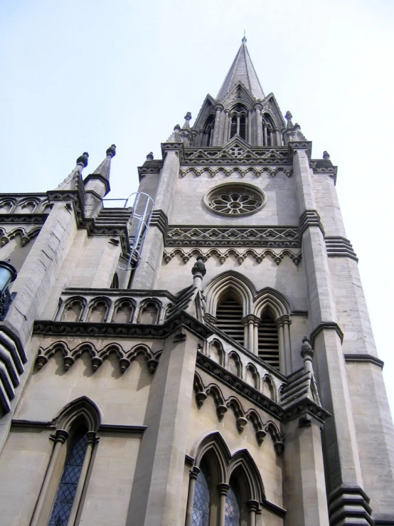 a large cathedral with some windows and a clock on it