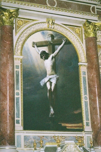 the crucifix hangs on the wall of the building