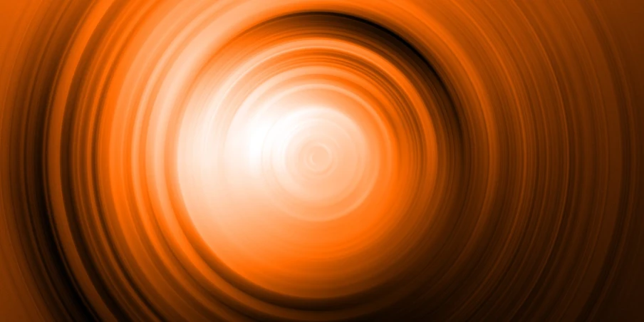 a large orange circle with an abstract background