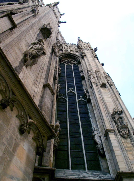 a close up view of a tall church with many windows