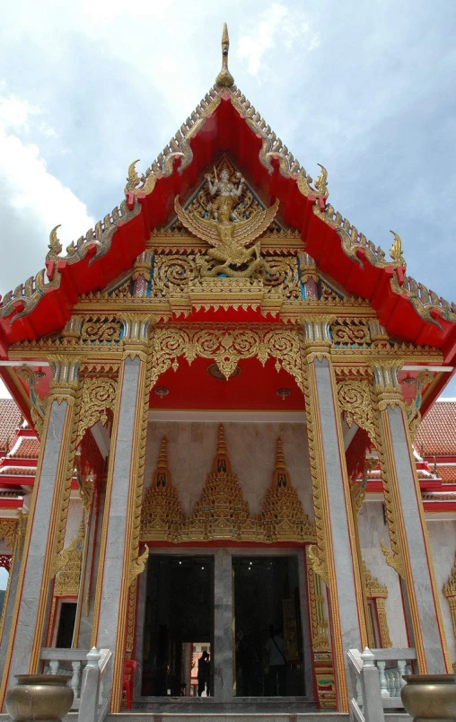 the entrance to a temple, which has an intricate decoration on it