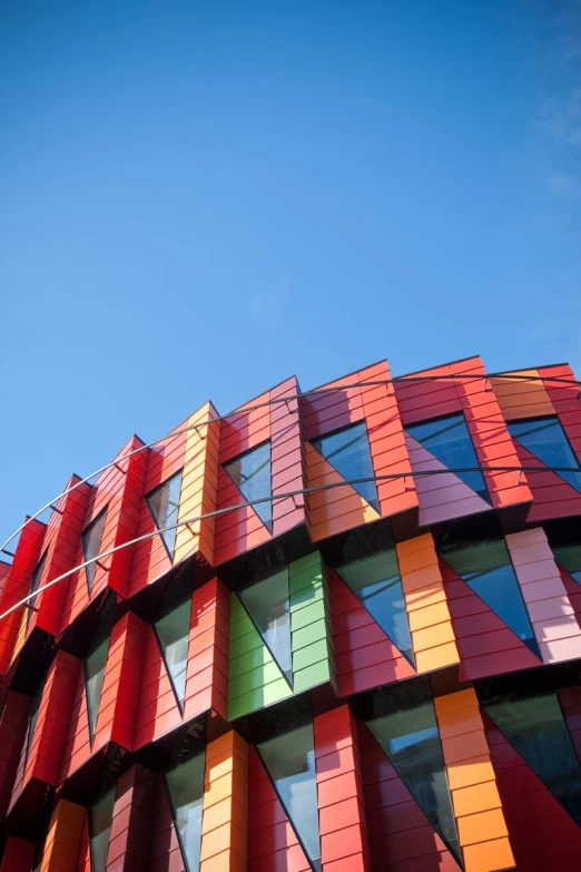 the face of a colorful building on a clear day