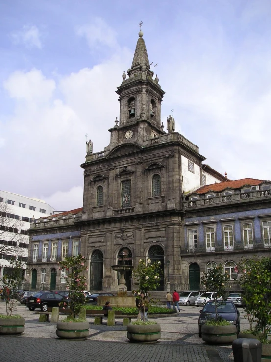 a building with several plants outside of it