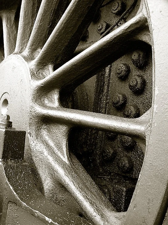 the front wheel of an airplane in black and white