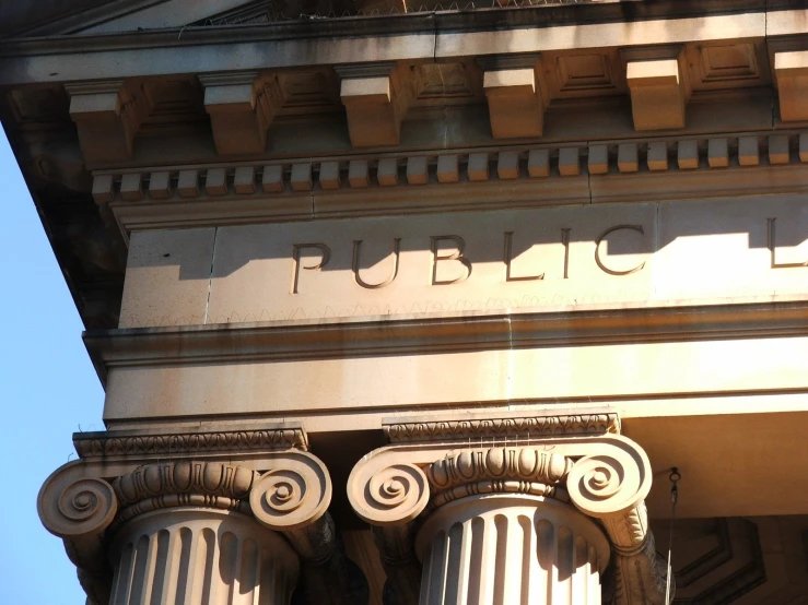 the corner of a building with pillars in front