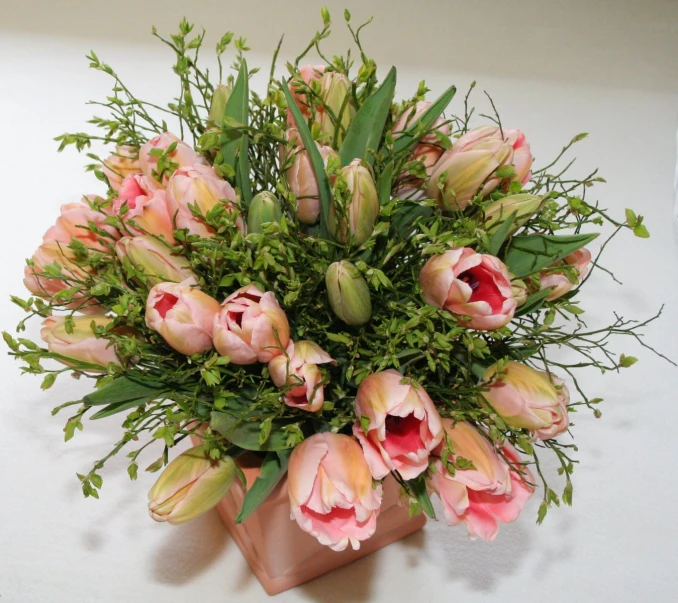 a bunch of flowers sitting on top of a counter