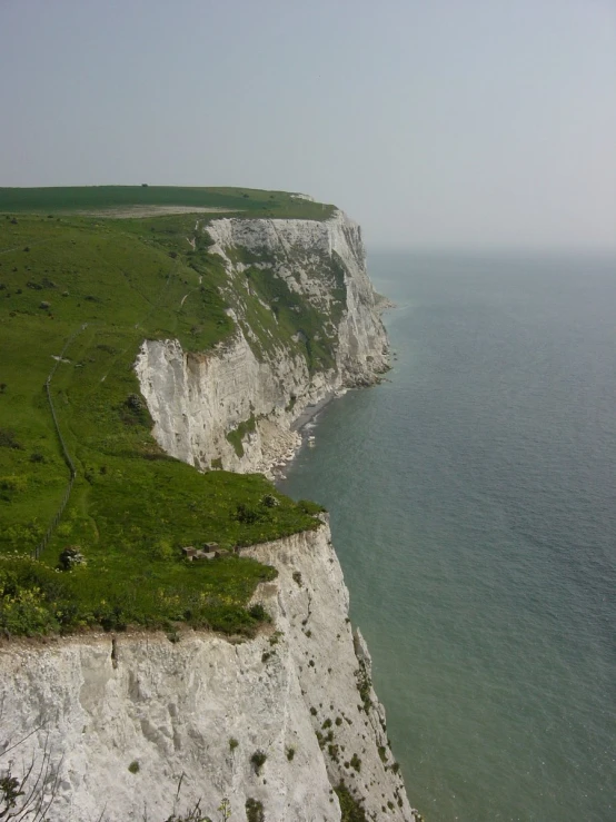 the view of cliffs and water from a cliff