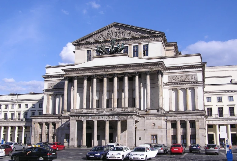 a very large building with lots of pillars and columns